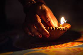 What's the significance of lighting a lamp for blessings and positivity?