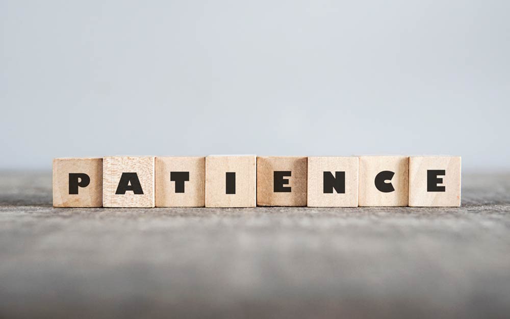 How does patience and surrender lead to unlocking life's goals?
