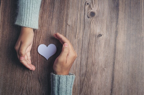 How can love and compassion lead to enlightenment?