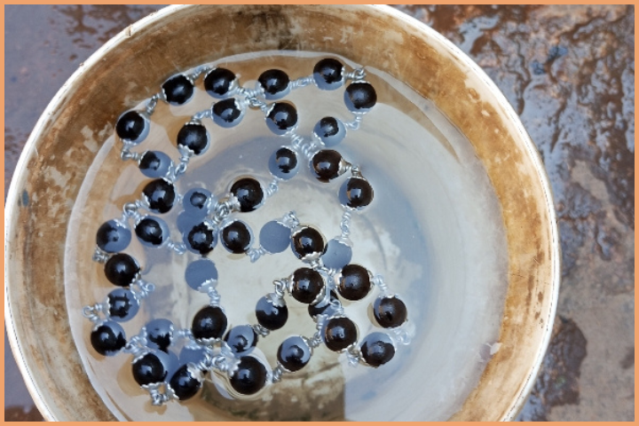 Wash the Karungali Malai with Clean Water