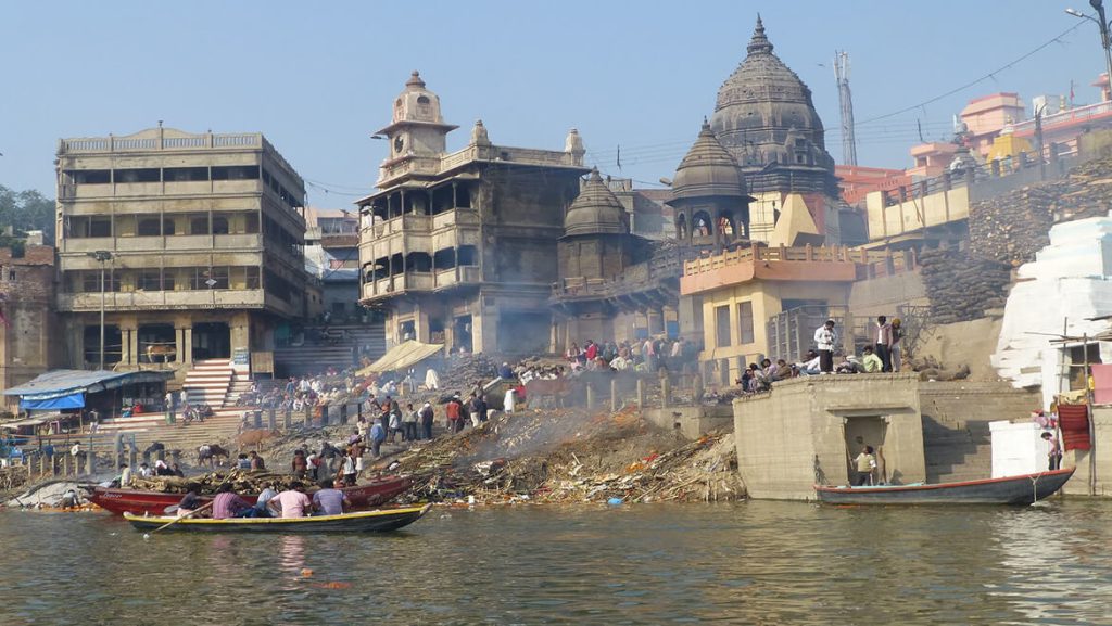 What is the spiritual essence of Harishchandra Ghat as a place of transformation?