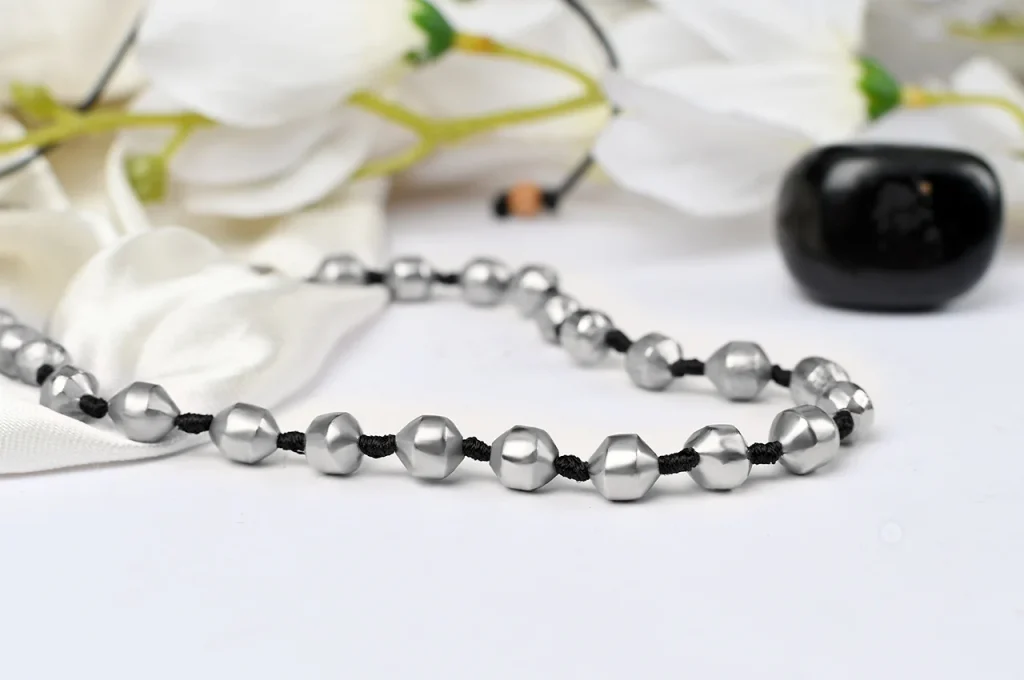 What mysteries do mystical mercury beads reveal beyond the physical realm?