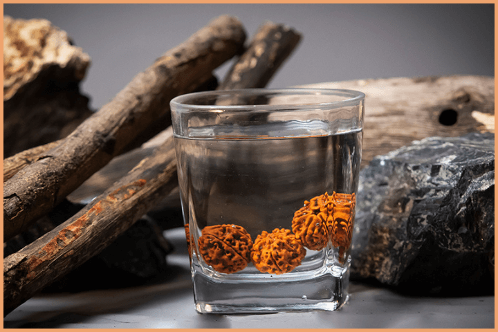 Cleanse 9 Mukhi Rudraksha bead with lukewarm water